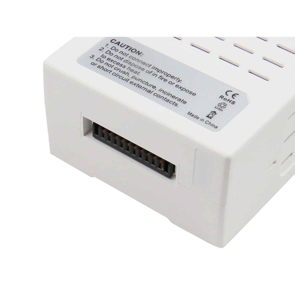 Dispositivo elettronico bianco con connettori ed etichette di avvertenza.