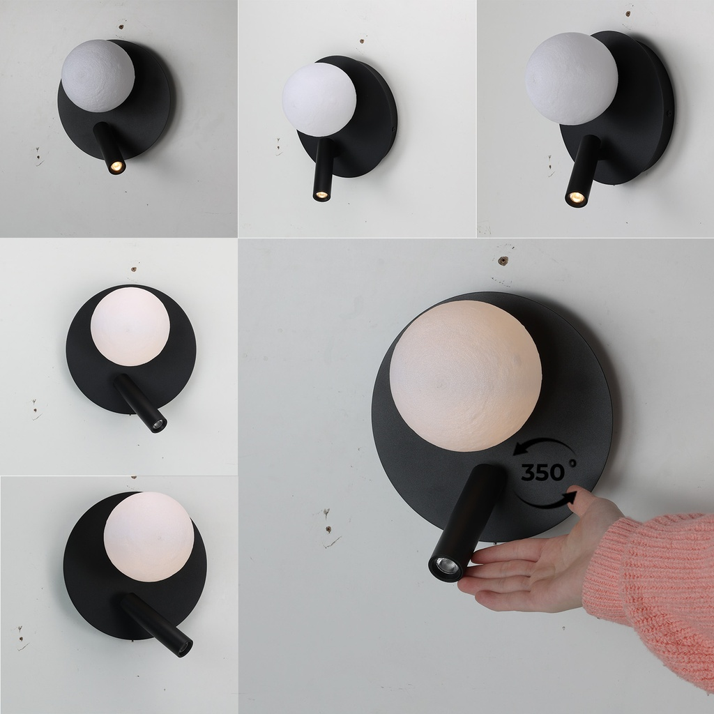 Lámpara de pared negra moderna con difusor redondo y foco ajustable.