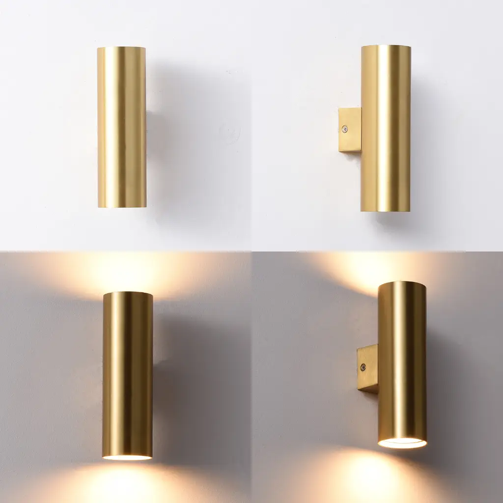 Dos apliques cilíndricos dorados, uno iluminado y otro no.
