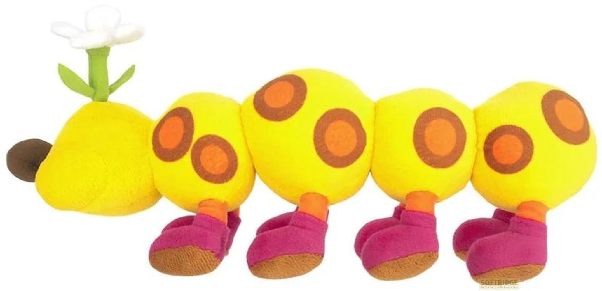 Gelbe Raupen-Plüschfigur mit orangefarbenen Punkten, lila Schuhen und einer Blume.