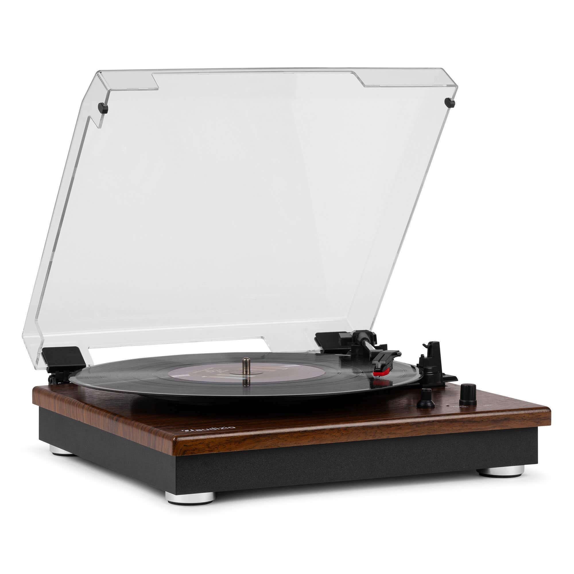 A turntable with a vinyl record and its clear lid open.