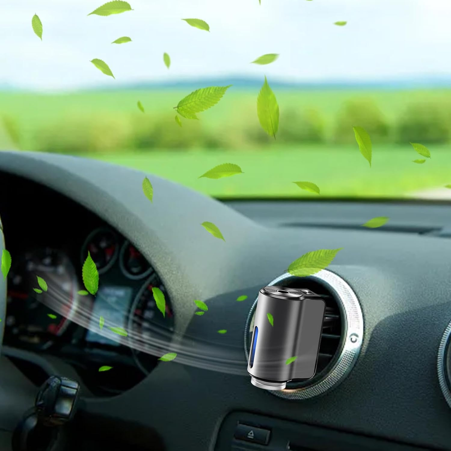 Un ambientador de coche rodeado de hojas verdes.