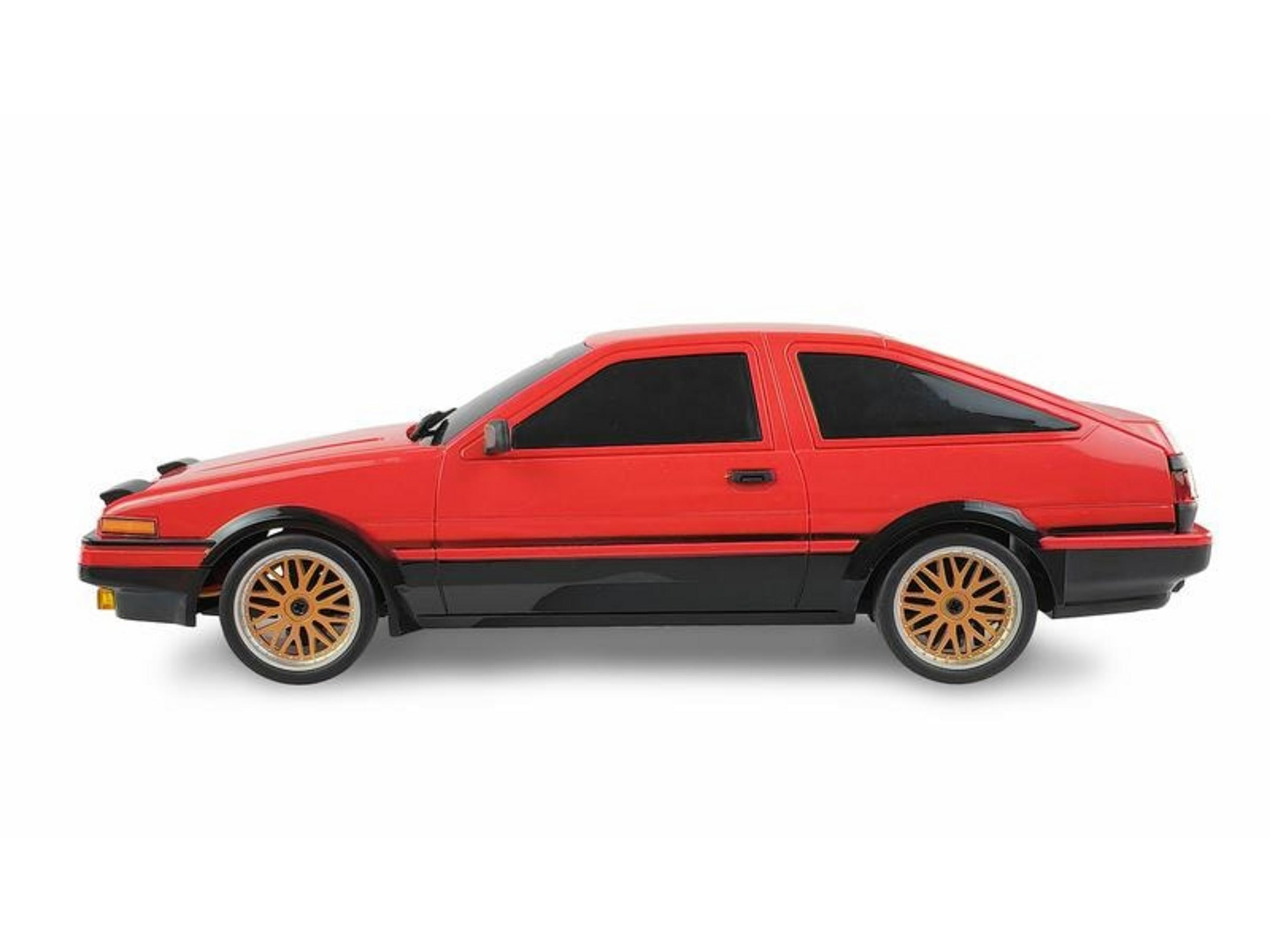 Rotes Sportcoupé mit schwarzen Akzenten und goldenen Felgen.