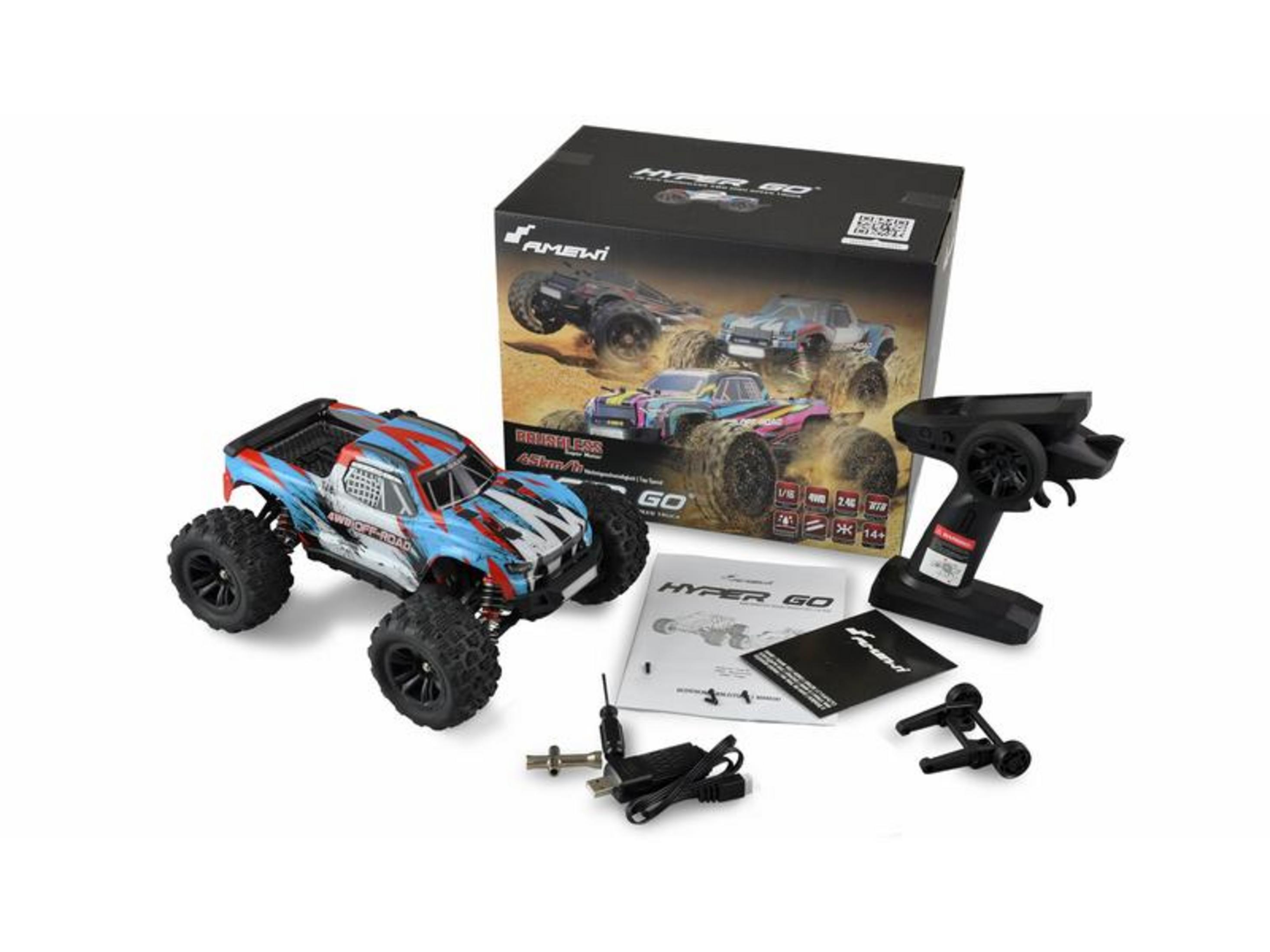 Camioneta RC, control remoto, accesorios y caja sobre fondo blanco.