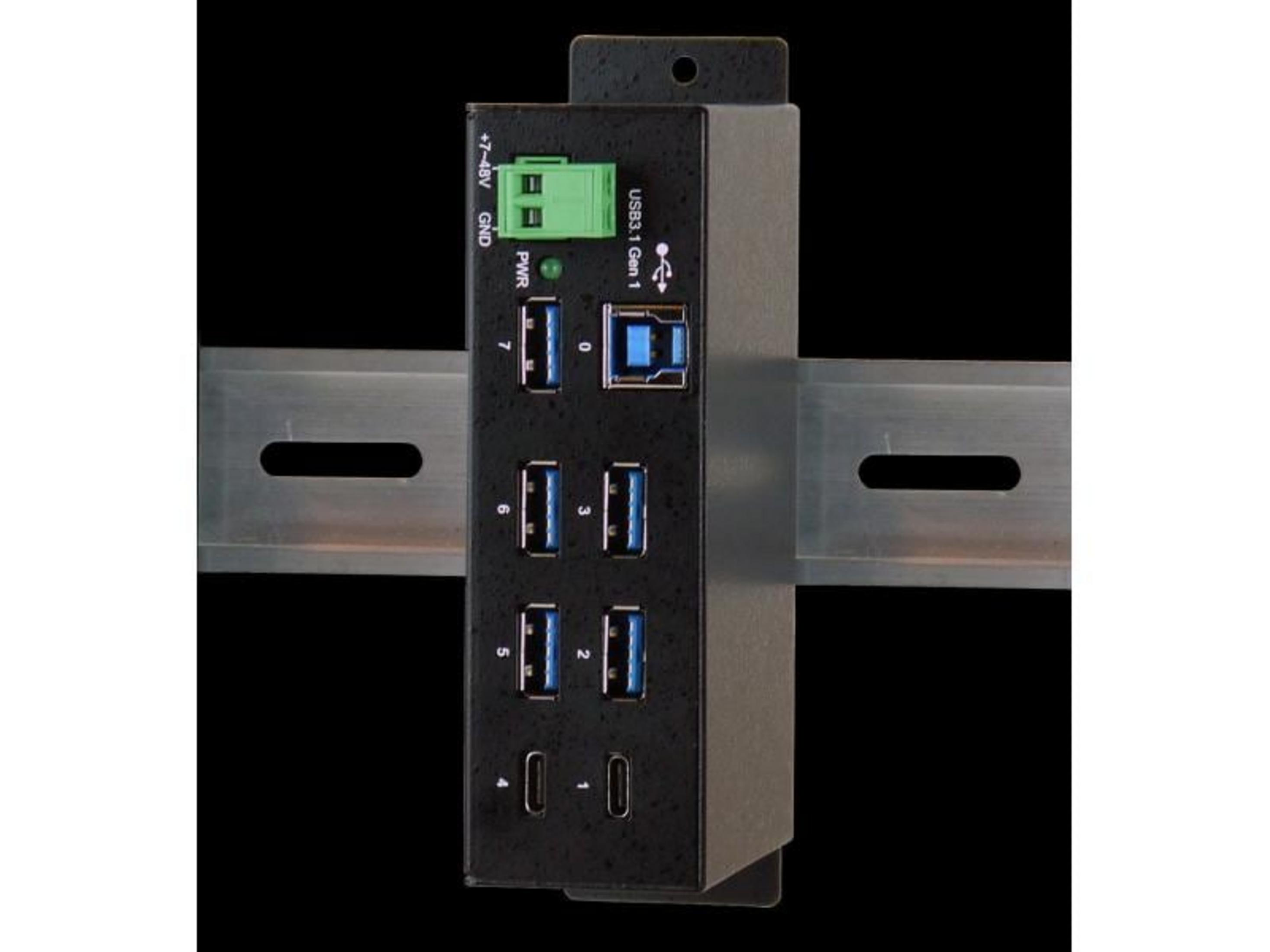 Ein schwarzes USB-Hub mit mehreren Anschlüssen, montiert auf einer DIN-Schiene.