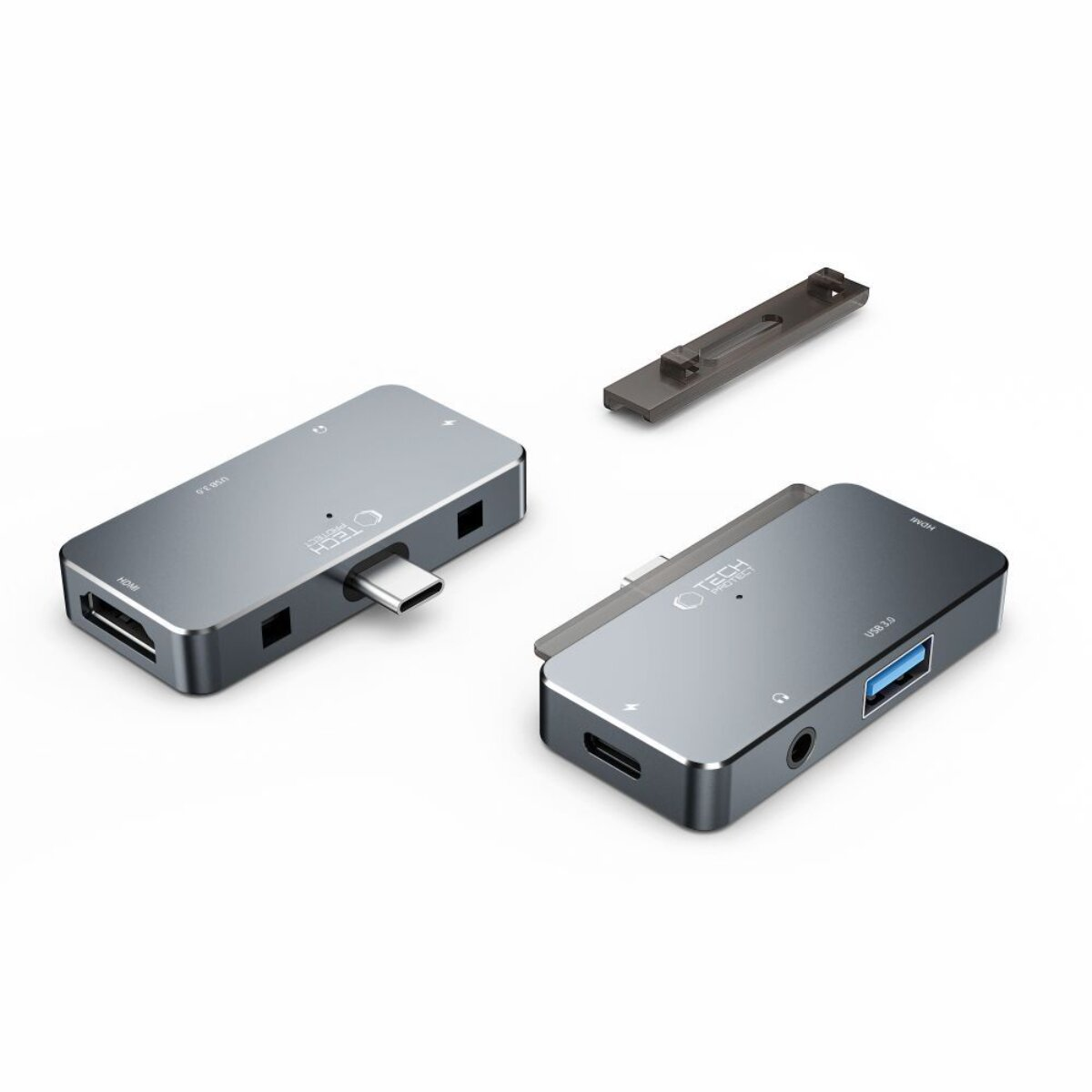 Due hub USB-C grigi con porte e un supporto grigio su sfondo bianco.