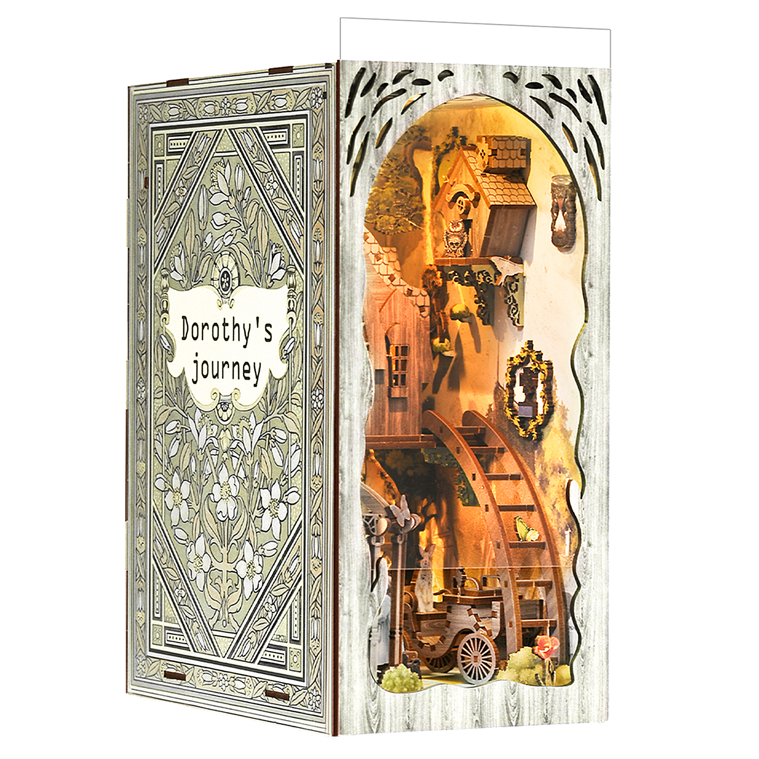 Un diorama libro intitolato 'Il viaggio di Dorothy' che mostra una scena paesaggistica in miniatura.