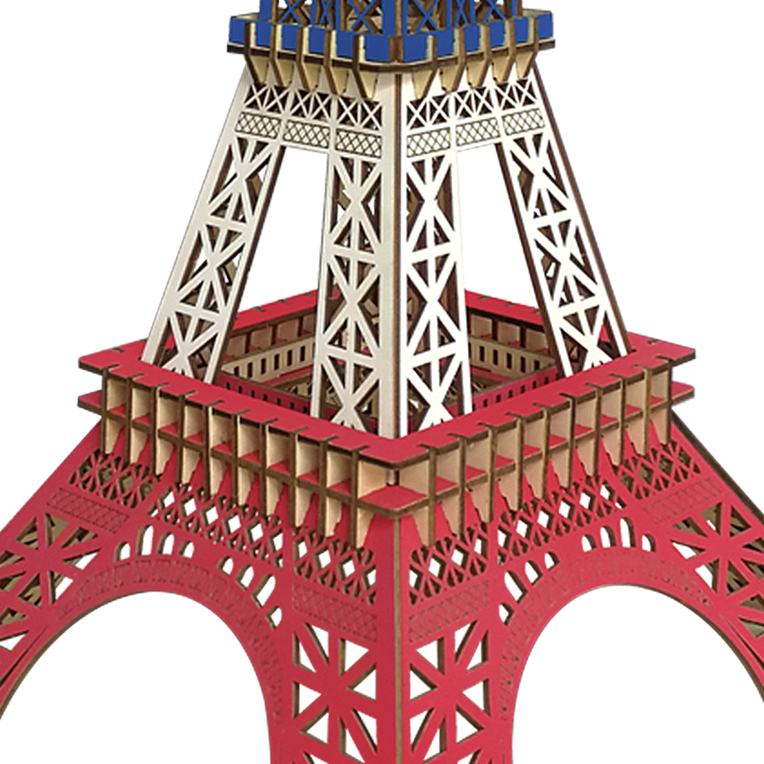Primo piano di un modello rosso e bianco della Torre Eiffel con accenti blu in cima.