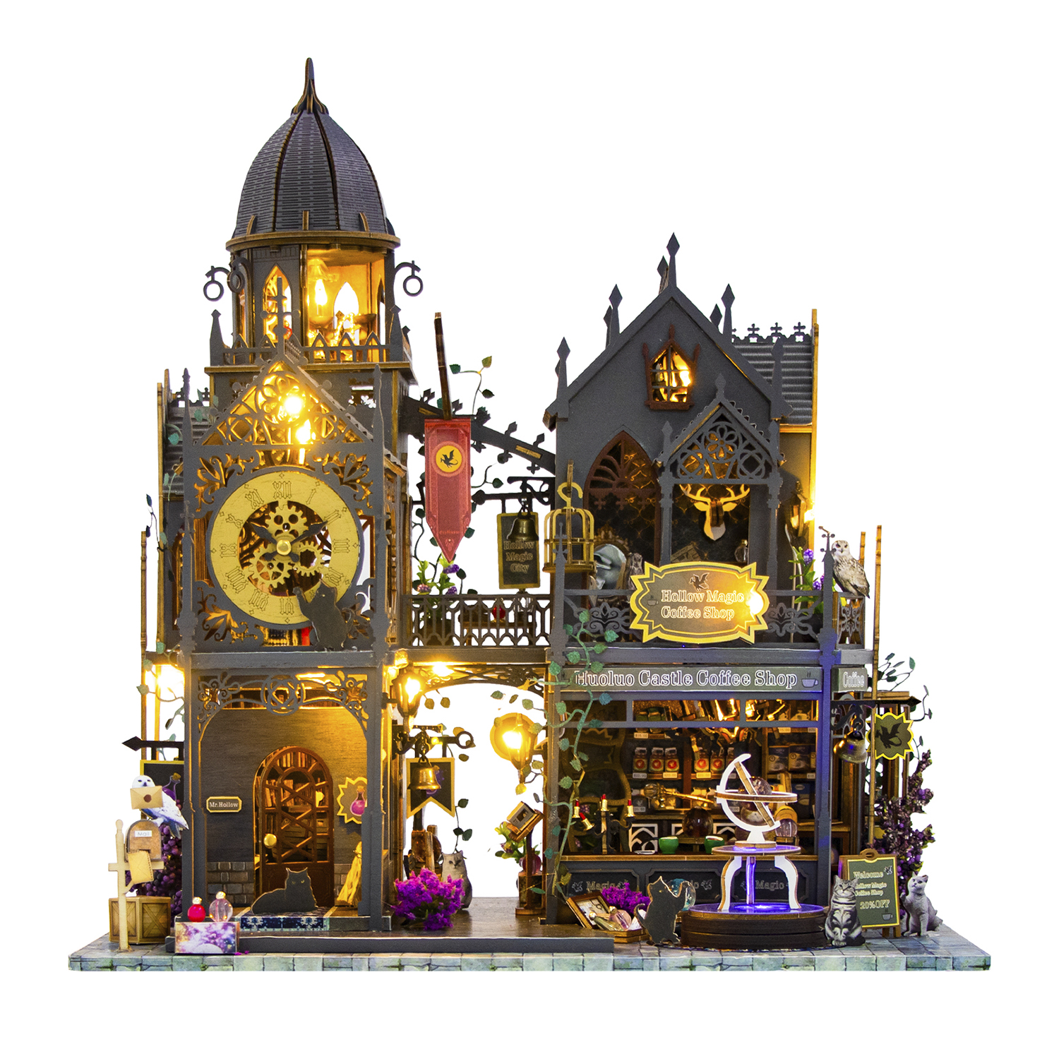 Edificio gotico in miniatura illuminato con torre dell'orologio e caffetteria.