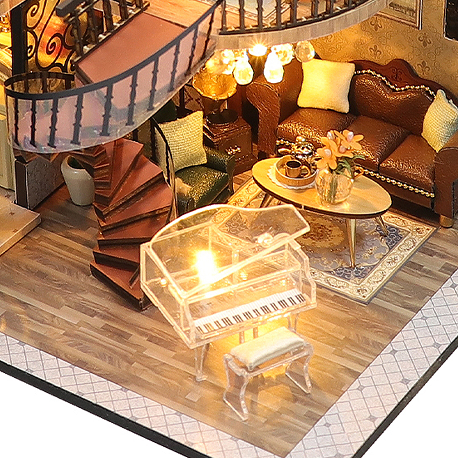 Soggiorno in miniatura con scala, pianoforte, divano e tavolo.
