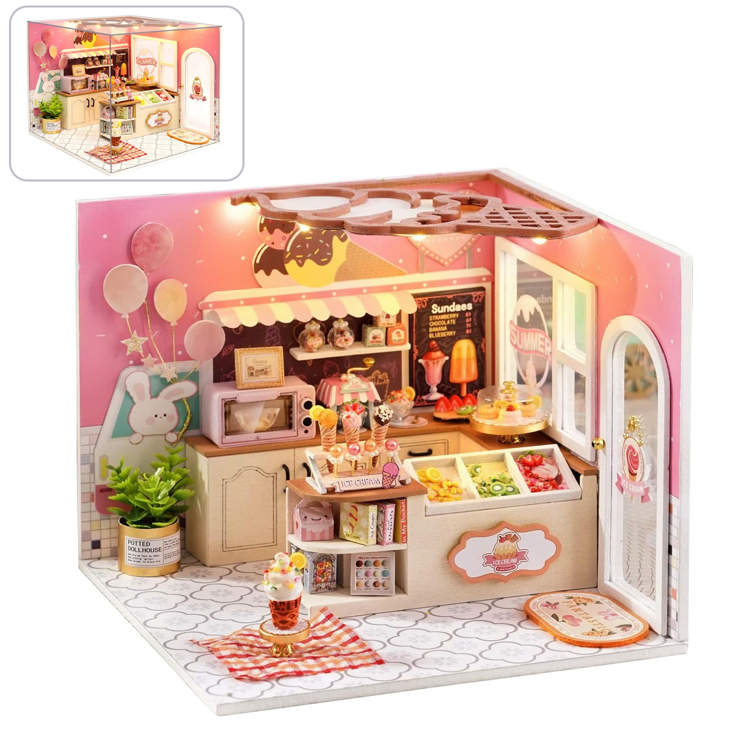 Mini gelateria con pareti rosa, gelati, torte e decorazioni.