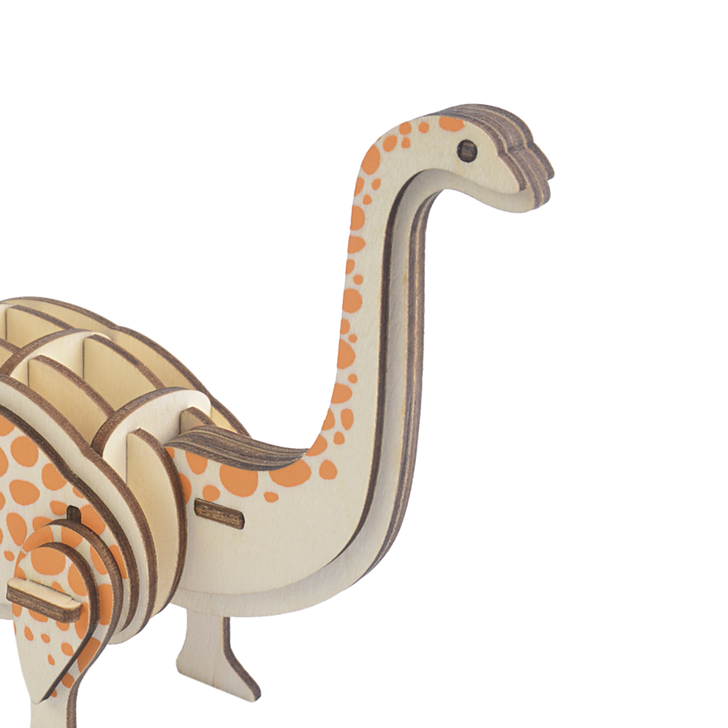 Un puzzle di dinosauro in legno con macchie arancioni su sfondo bianco.