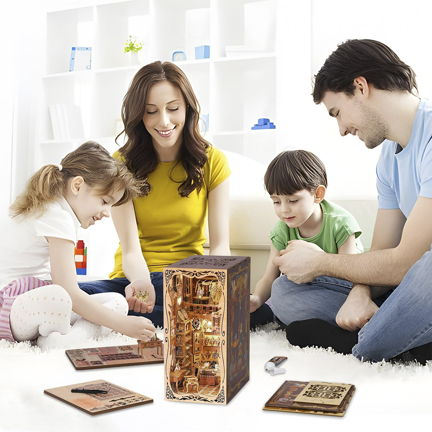 Famiglia costruisce una dettagliata casa modello in legno in salotto.