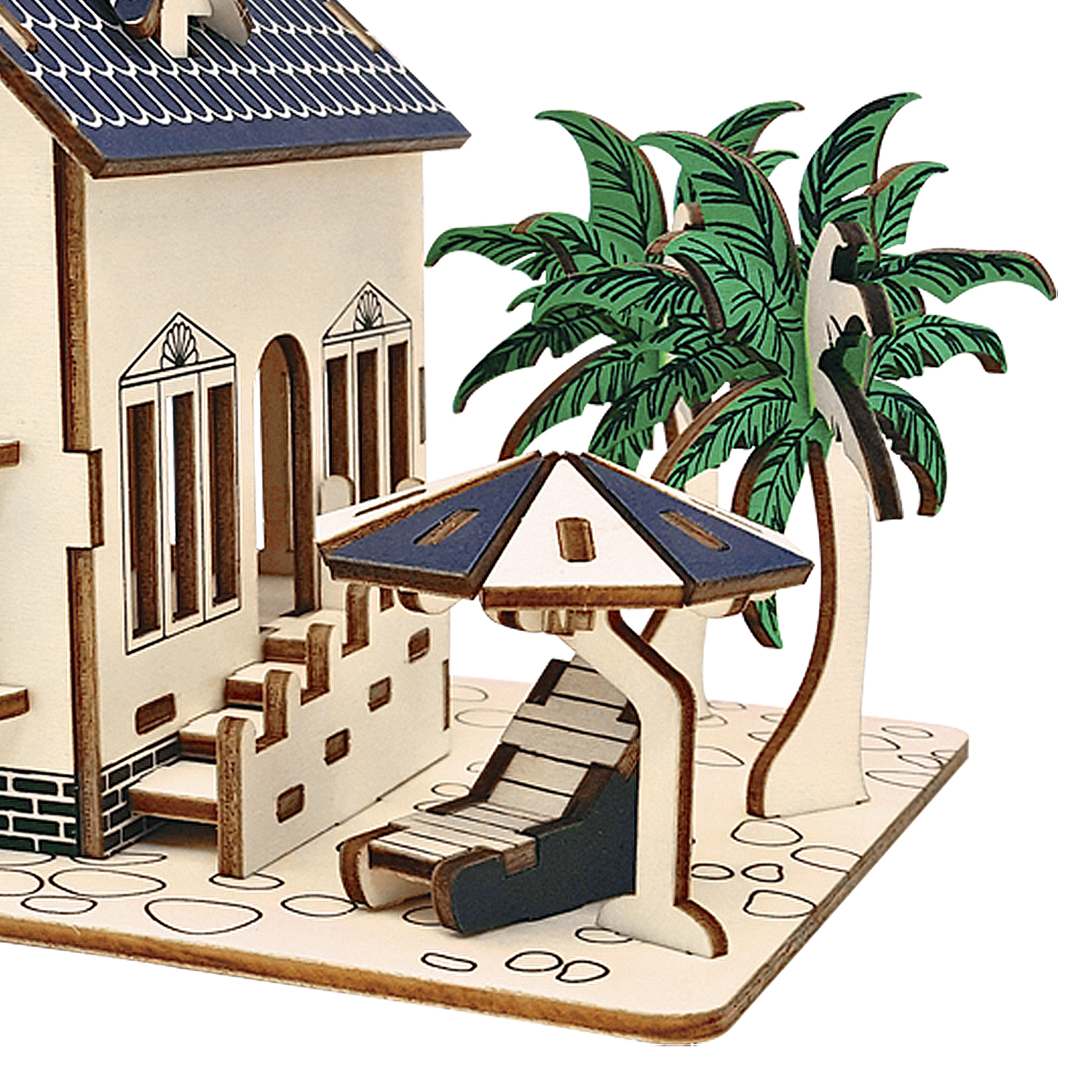 Modello in legno di una casa con palme e lettino.
