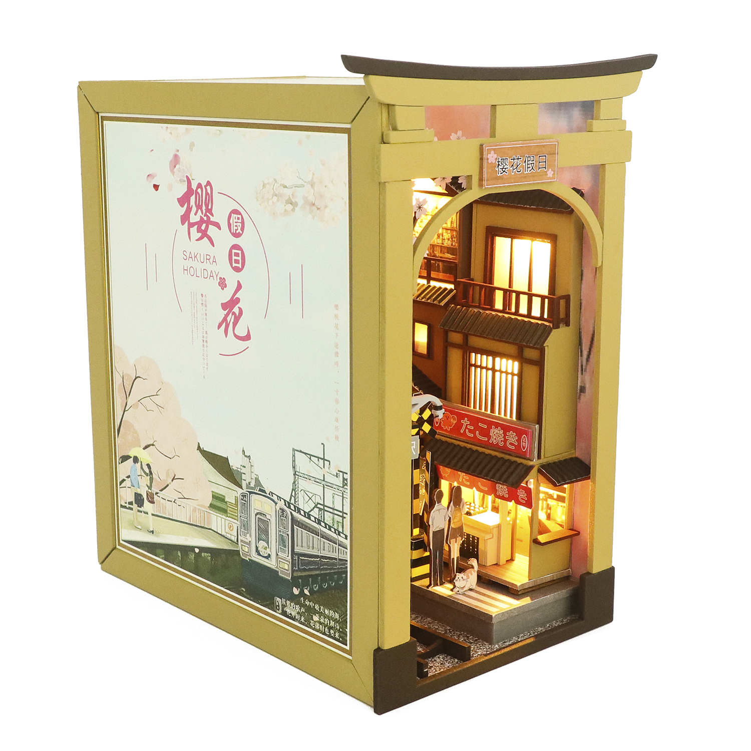 Casa in miniatura con scena giapponese, cancello torii, negozio e treno.