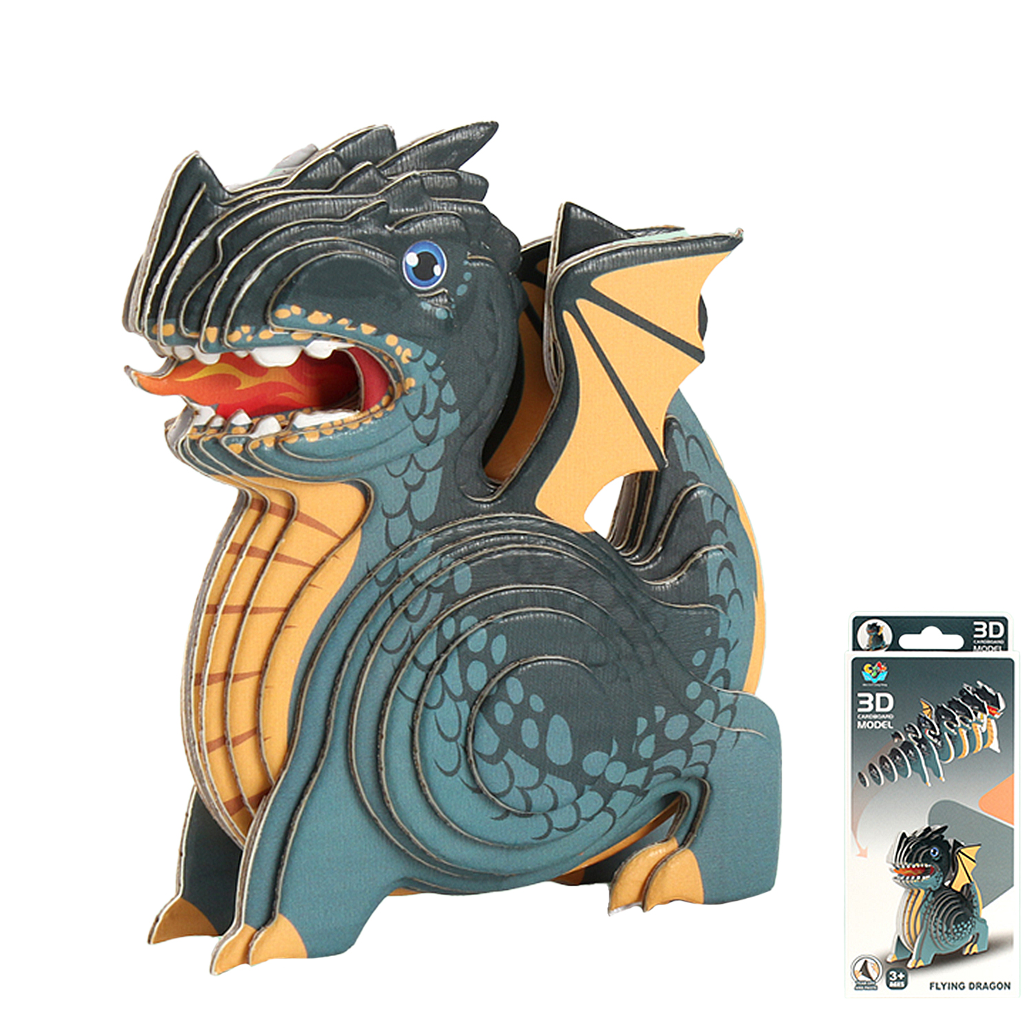 Un drago di cartone blu-verde con ali gialle sputa fuoco. Una confezione è accanto.