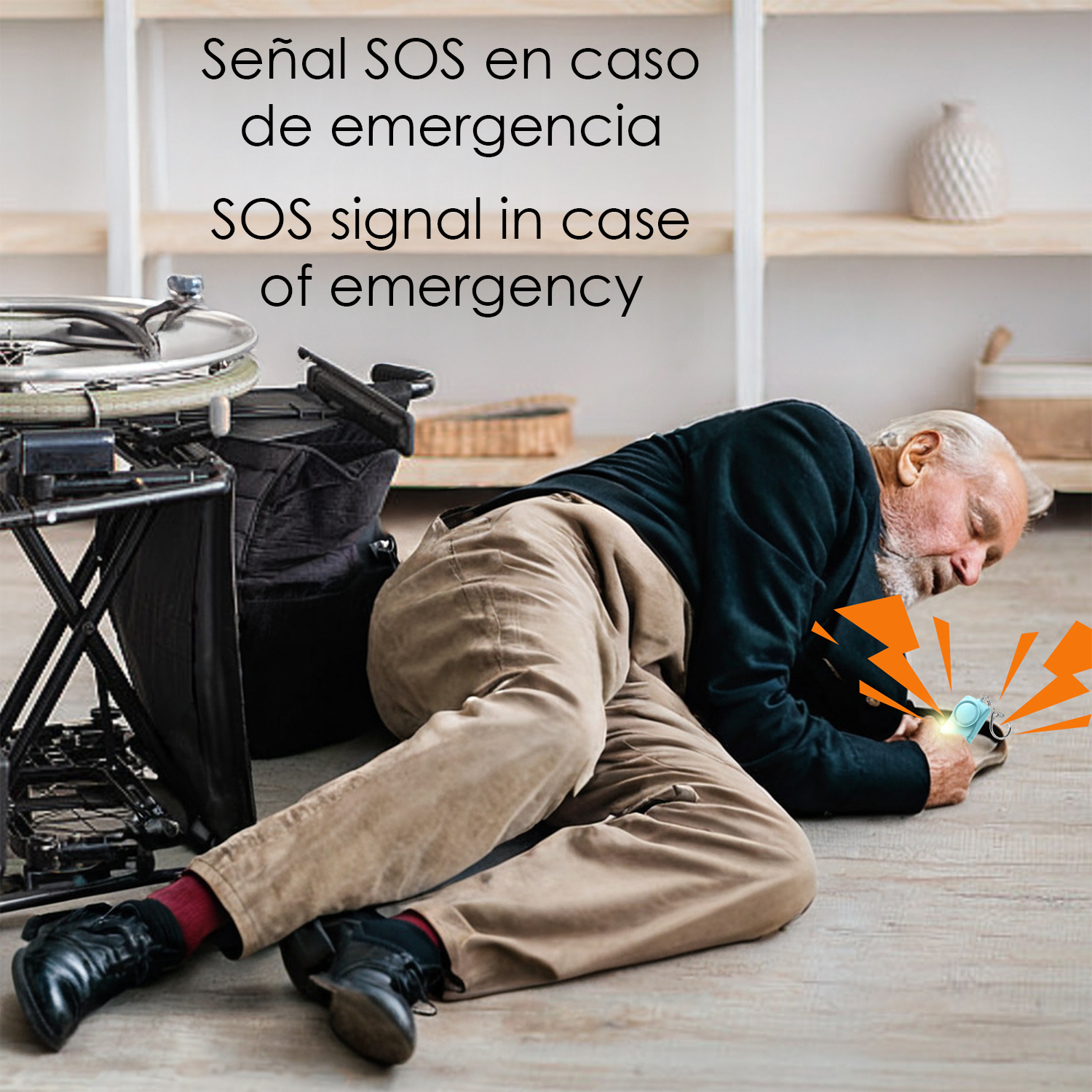 Un anciano yace en el suelo junto a una silla de ruedas, pulsando un botón de alarma.