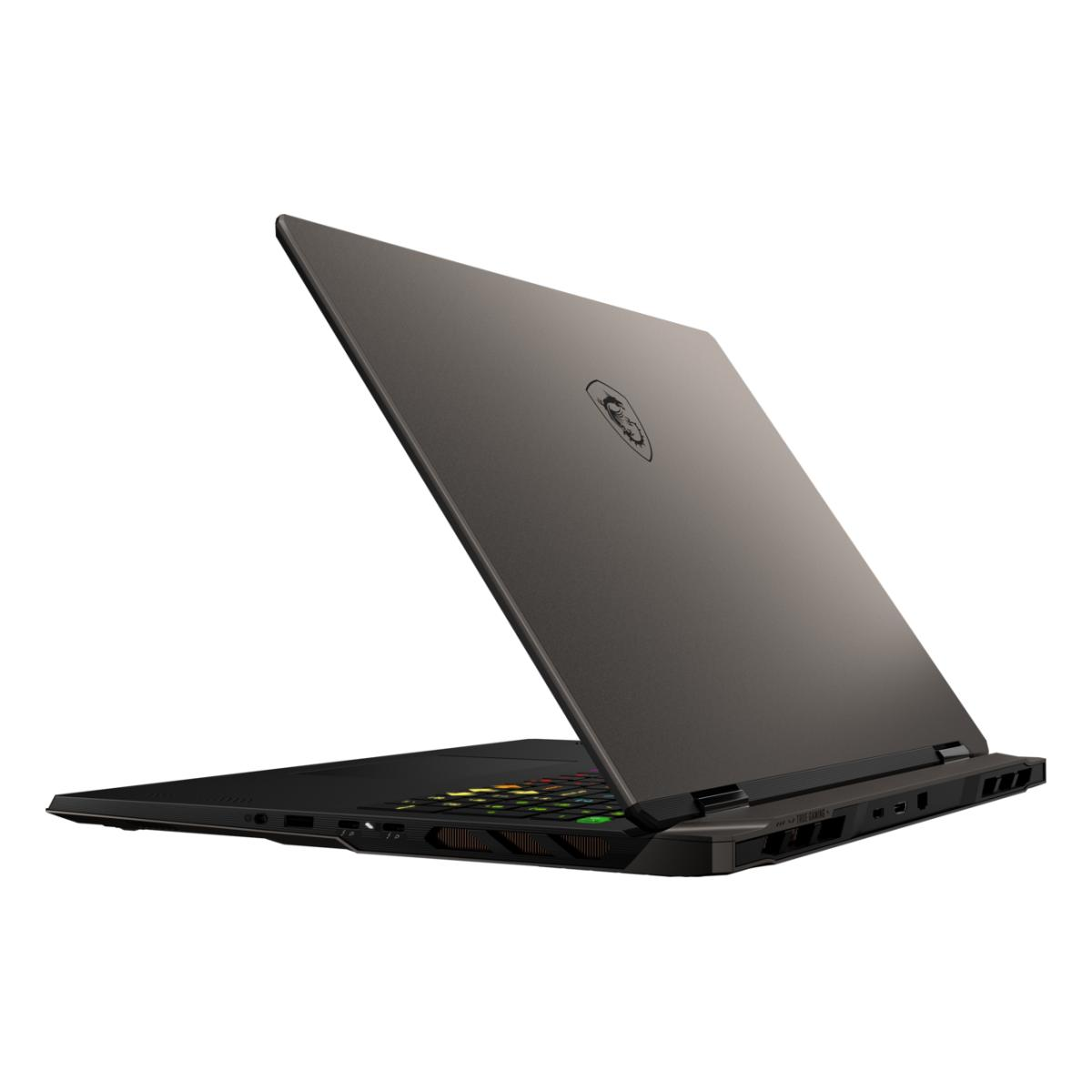 Ein geschlossener grauer Laptop mit beleuchteter Tastatur und MSI-Logo auf dem Deckel.