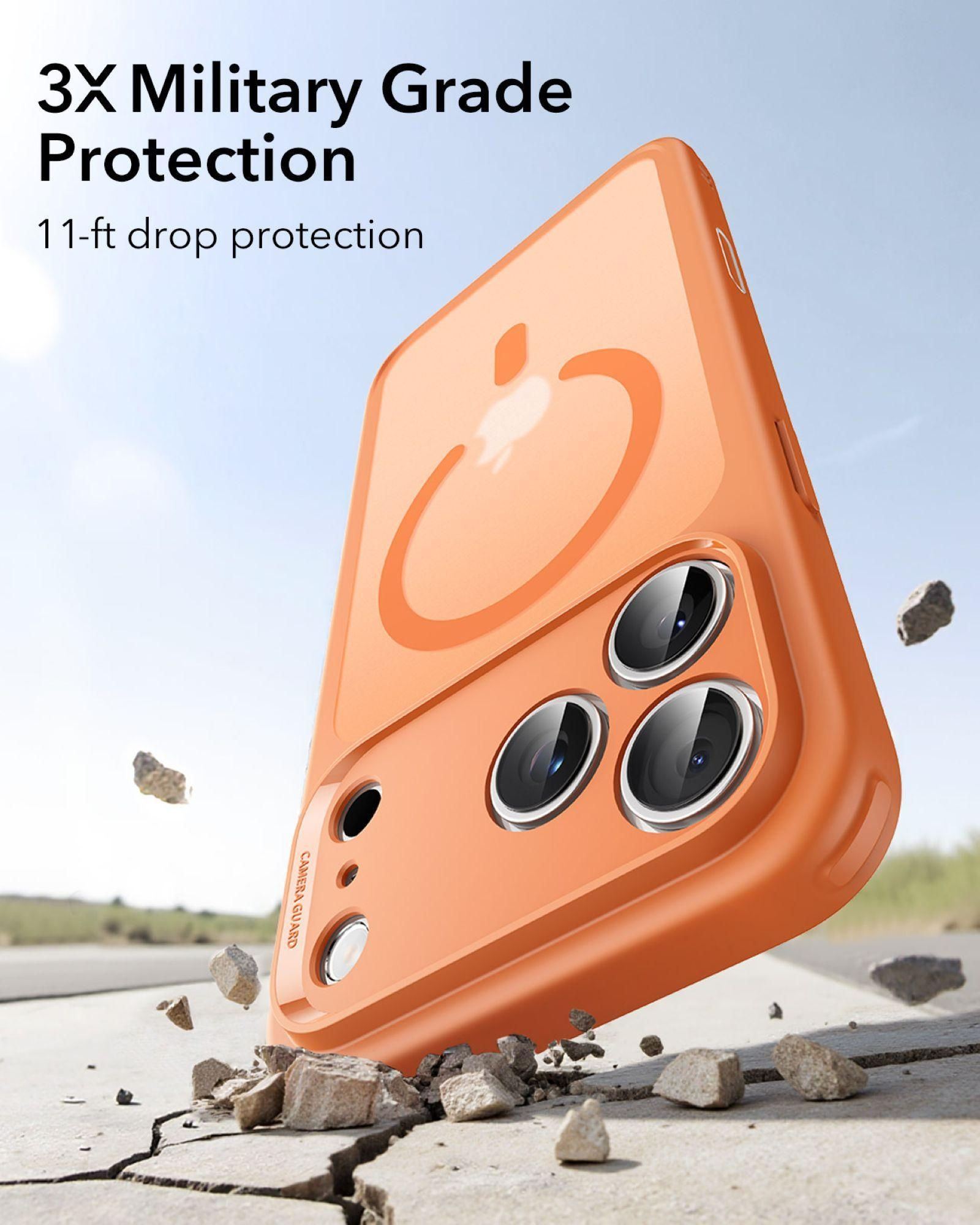Orange Handyhülle mit MagSafe-Logo fällt auf zerbrochenen Beton.
