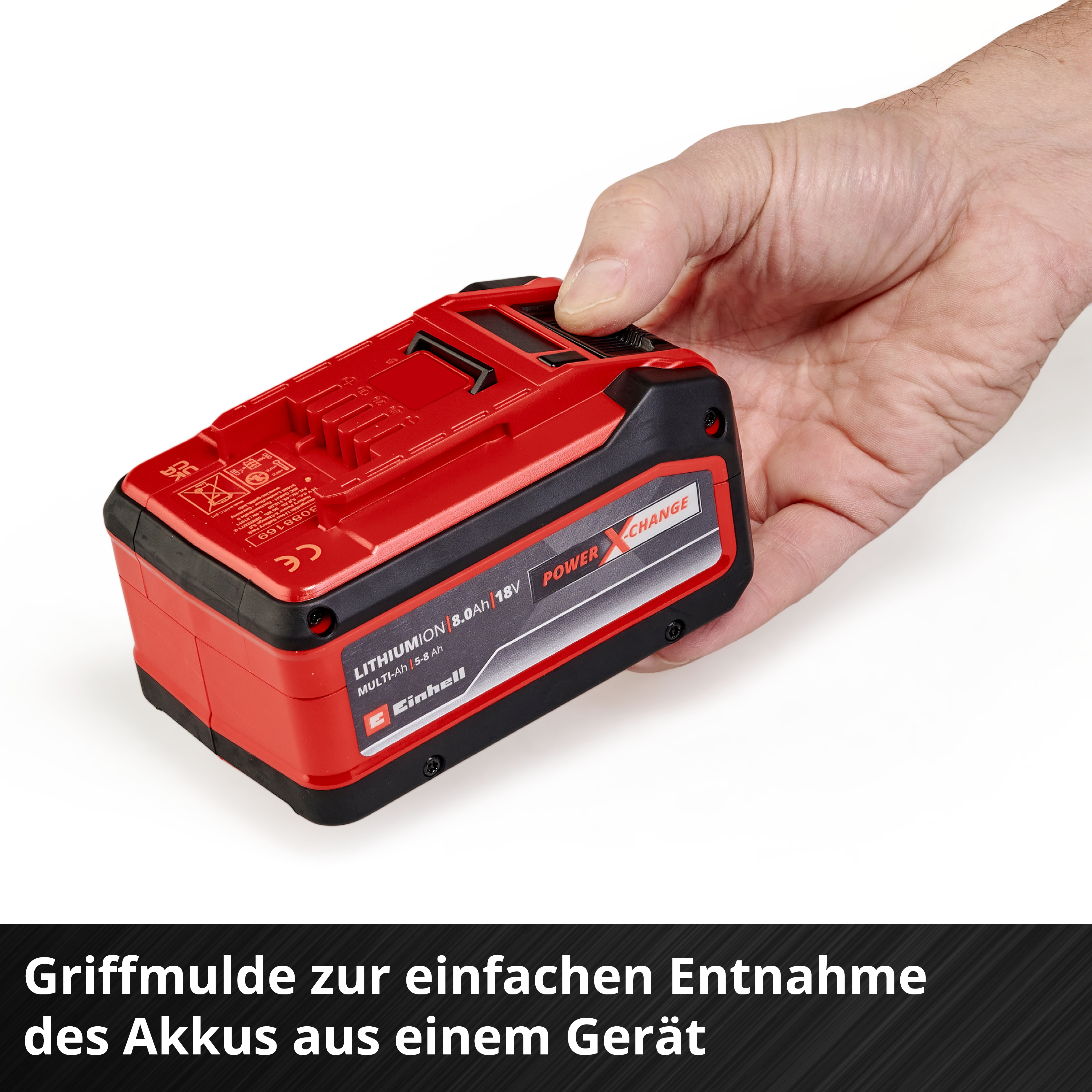 Rote Lithium-Ionen-Batterie wird von einer Hand gehalten, mit Beschriftung.