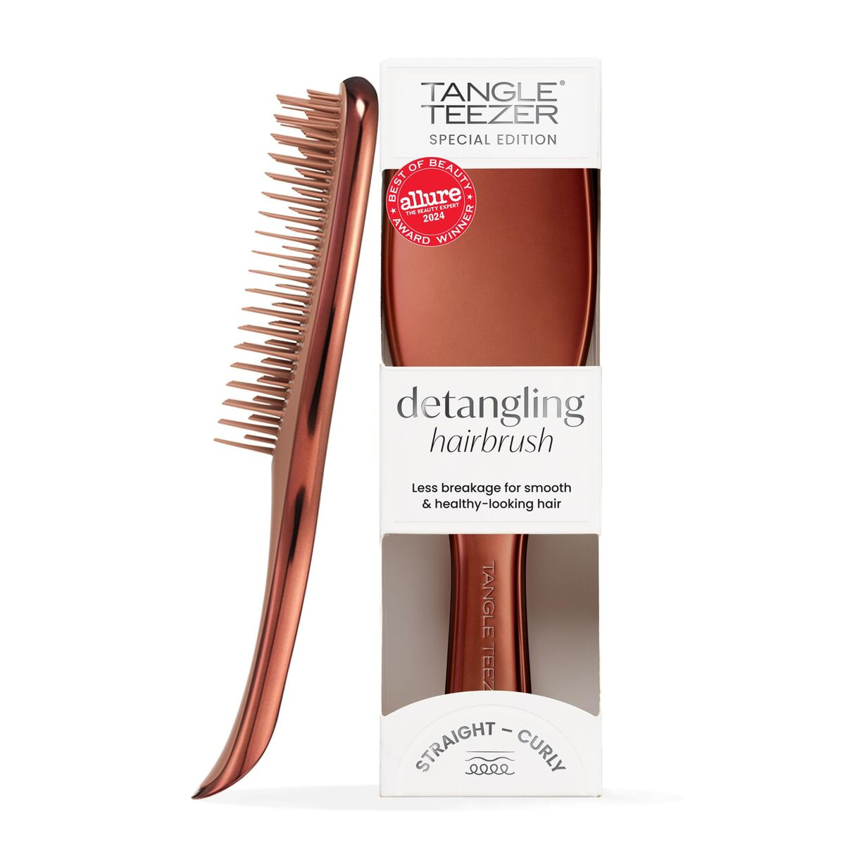 Un Tangle Teezer color rame con un premio sulla confezione.