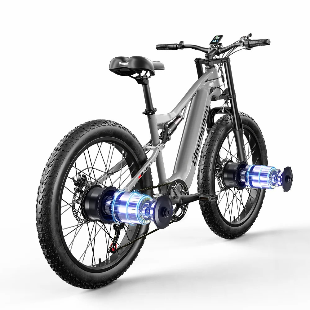 Graues E-Bike mit zwei Motoren und fetten Reifen vor weißem Hintergrund.