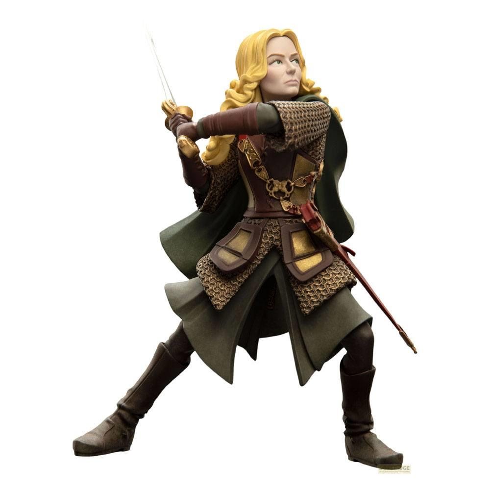 Eine Frau mit blonden Locken in Rüstung hält ein Schwert in der Hand.