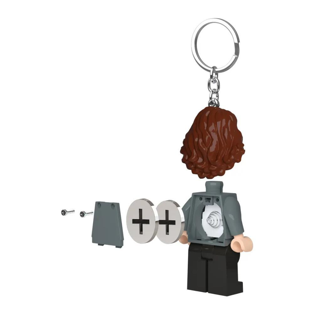 Ayrılabilir parçalara sahip Lego anahtarlık: kahverengi saç, gövde, iki daire, vidalar.