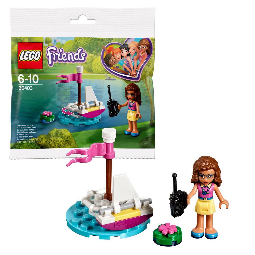 Set LEGO Friends con barca, personaggio e walkie-talkie. Include anche un piccolo oggetto verde.