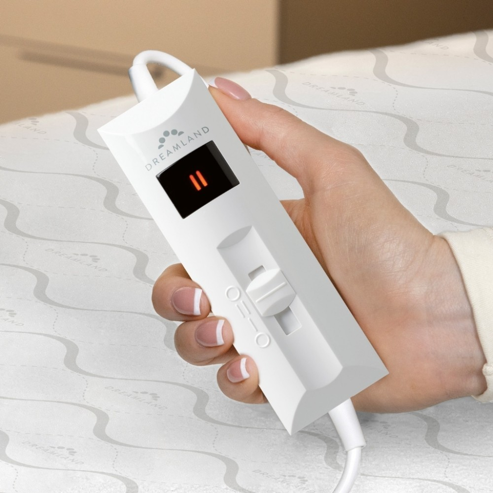 Hand holding white Dreamland controller with digital display showing '11'.