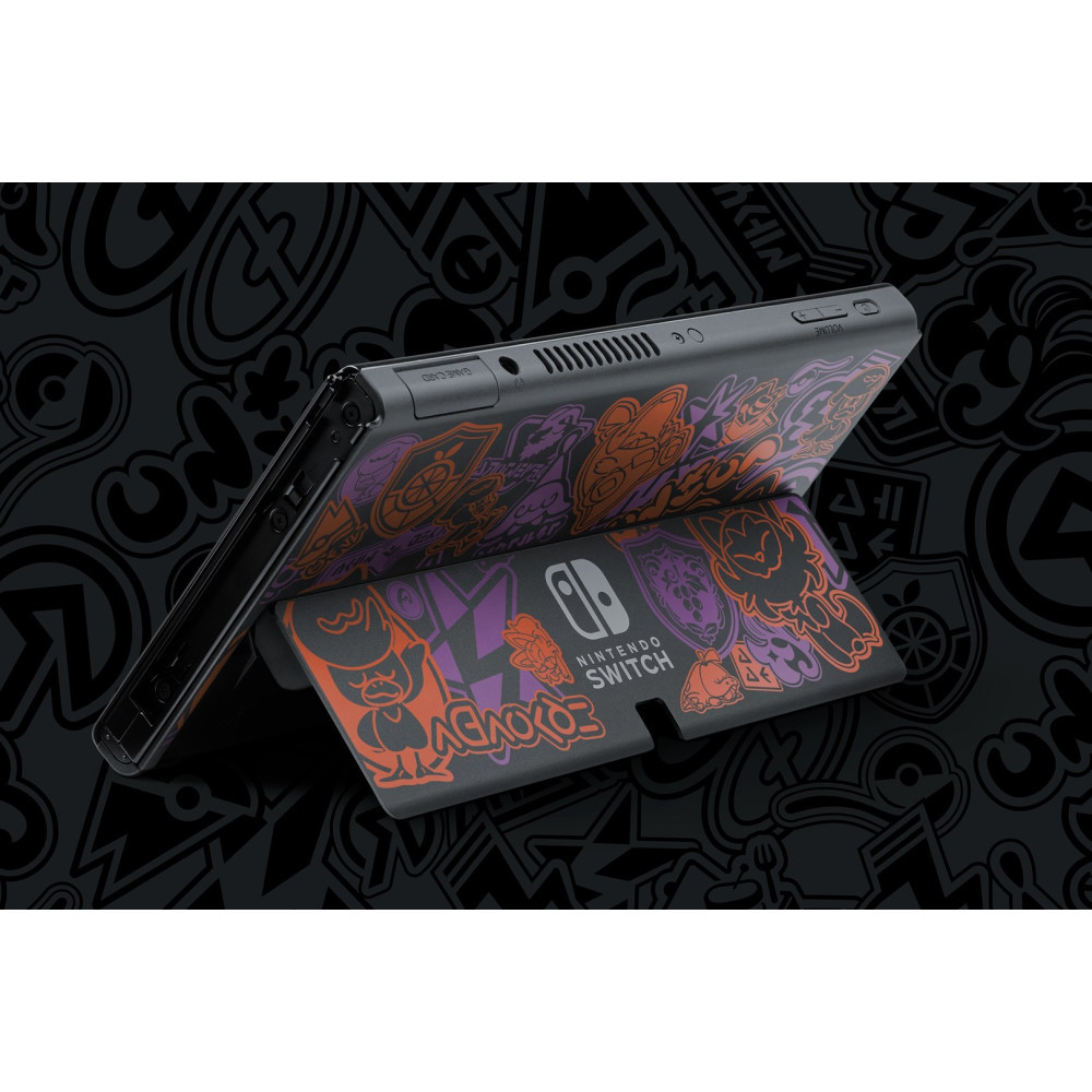 Konsola Nintendo Switch z fioletowo-pomarańczowymi grafikami Splatoon na czarnym tle.