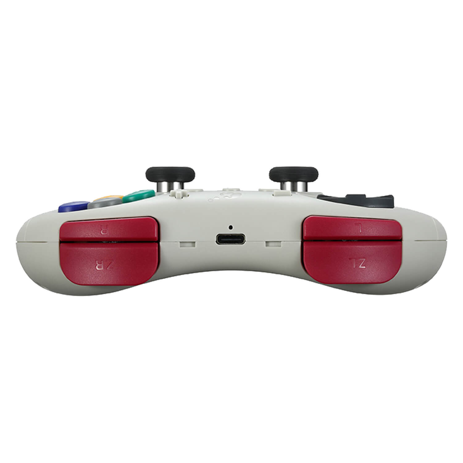 Un controlador gris con botones rojos en los hombros y joysticks negros.