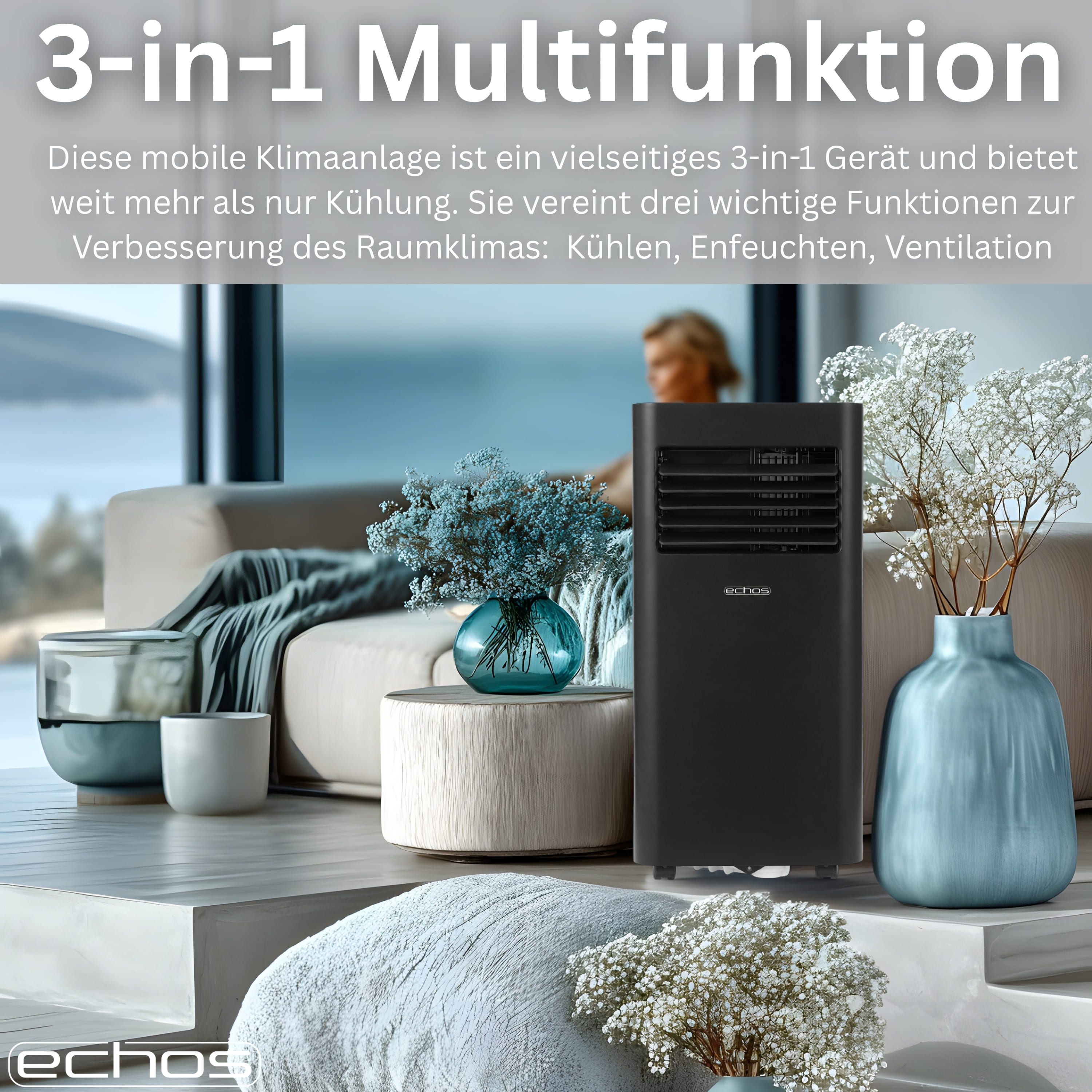 Schwarzes 3-in-1-Klimagerät neben Vasen und Blumen auf einem Sofa.