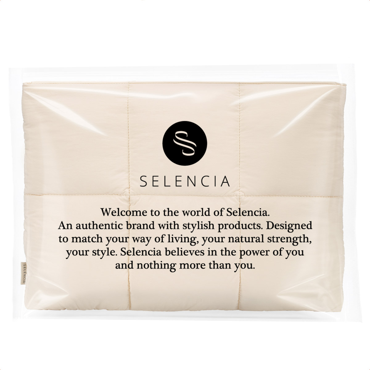 A cream-colored quilted fabric with the black Selencia logo and brand text printed on it, encased in clear plastic.