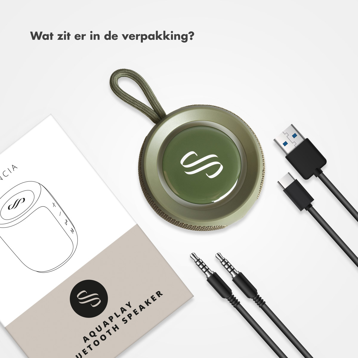 Groene Bluetooth speaker met kabels en handleiding op witte achtergrond.
