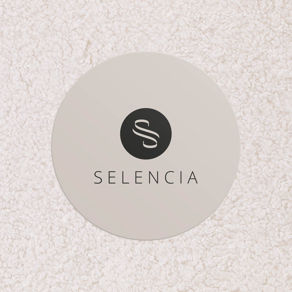 Beige circle with black 'S' logo and 'SELEENCIA' text on a fluffy background.