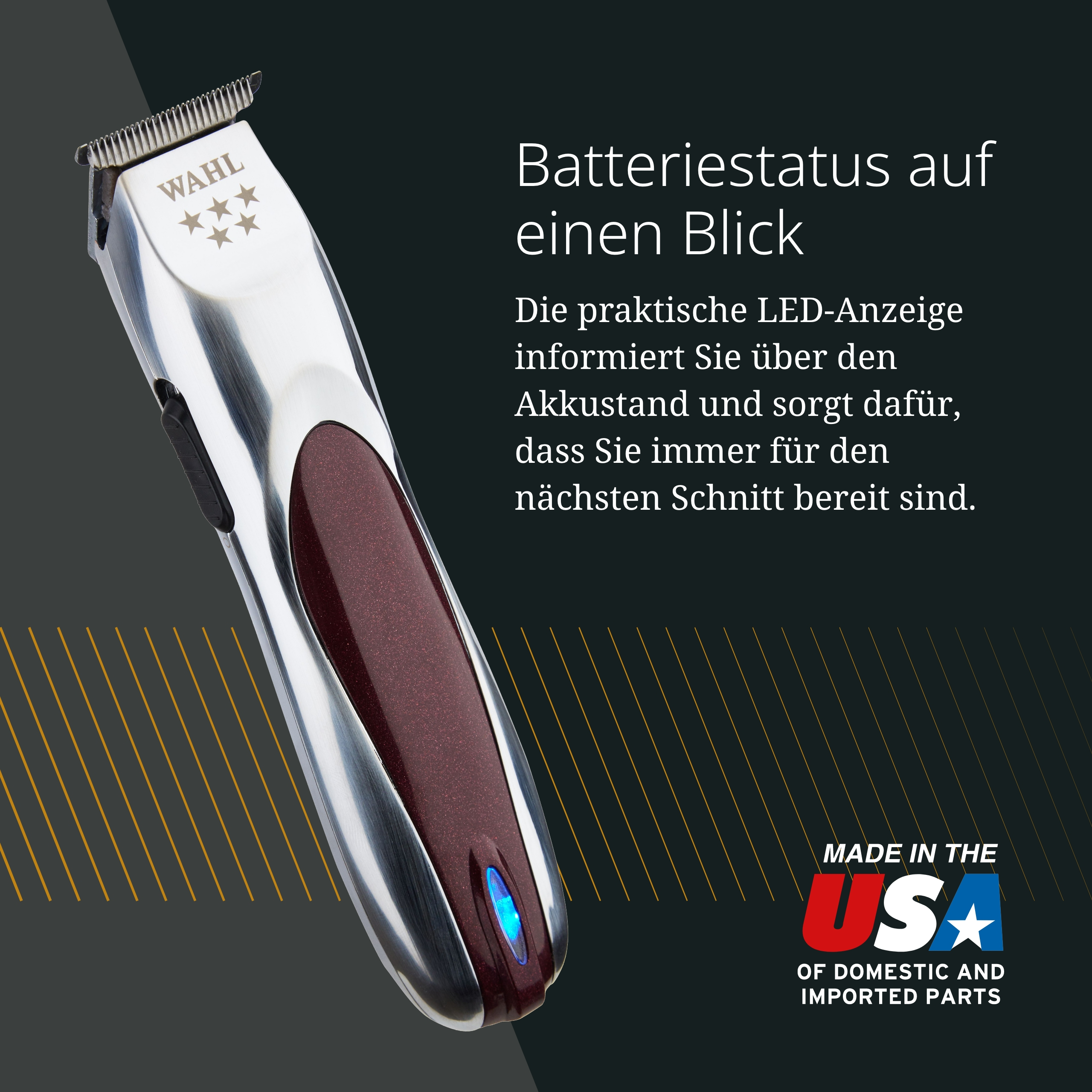 Ein silberner WAHL Haarschneider mit rotem Griff und blauer LED. Made in USA.