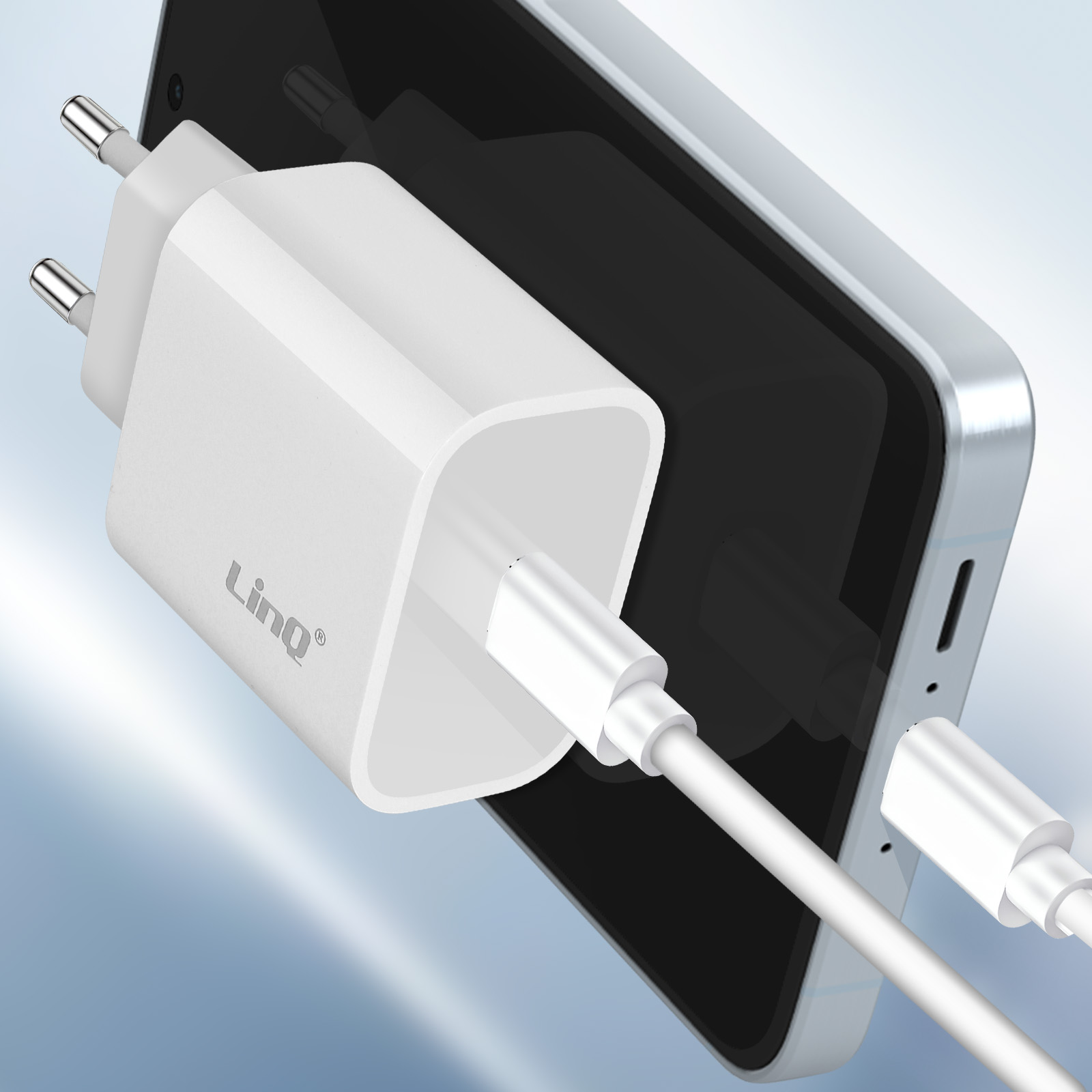 Un adaptateur secteur blanc avec câble USB-C charge un smartphone.