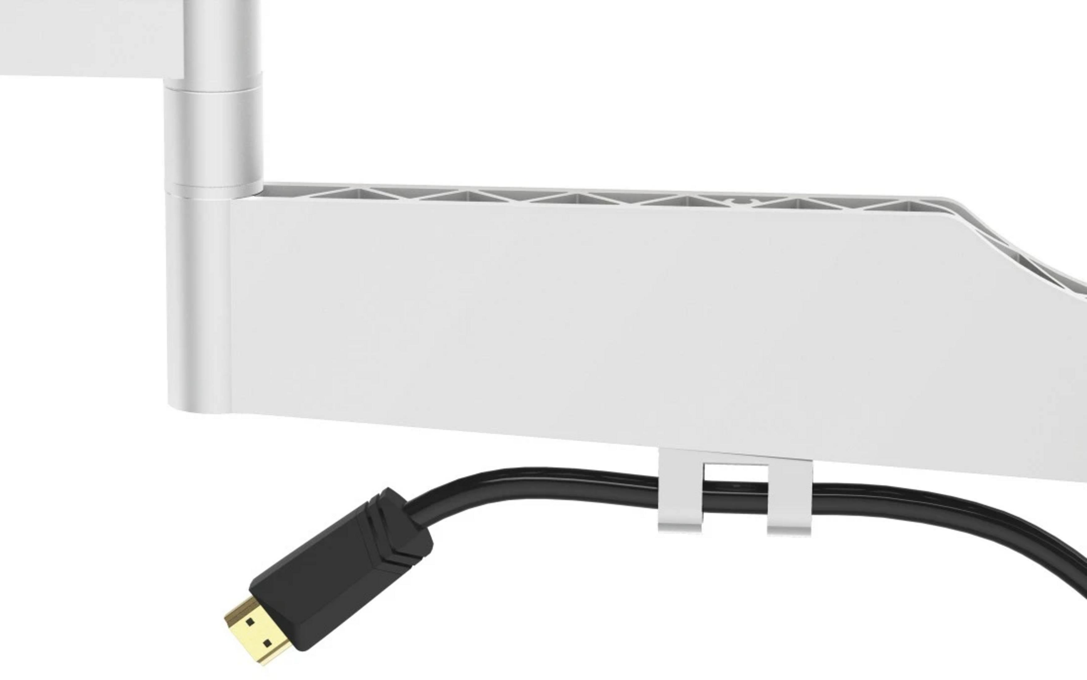Białe ramię z czarnym kablem HDMI przymocowanym klipsem.