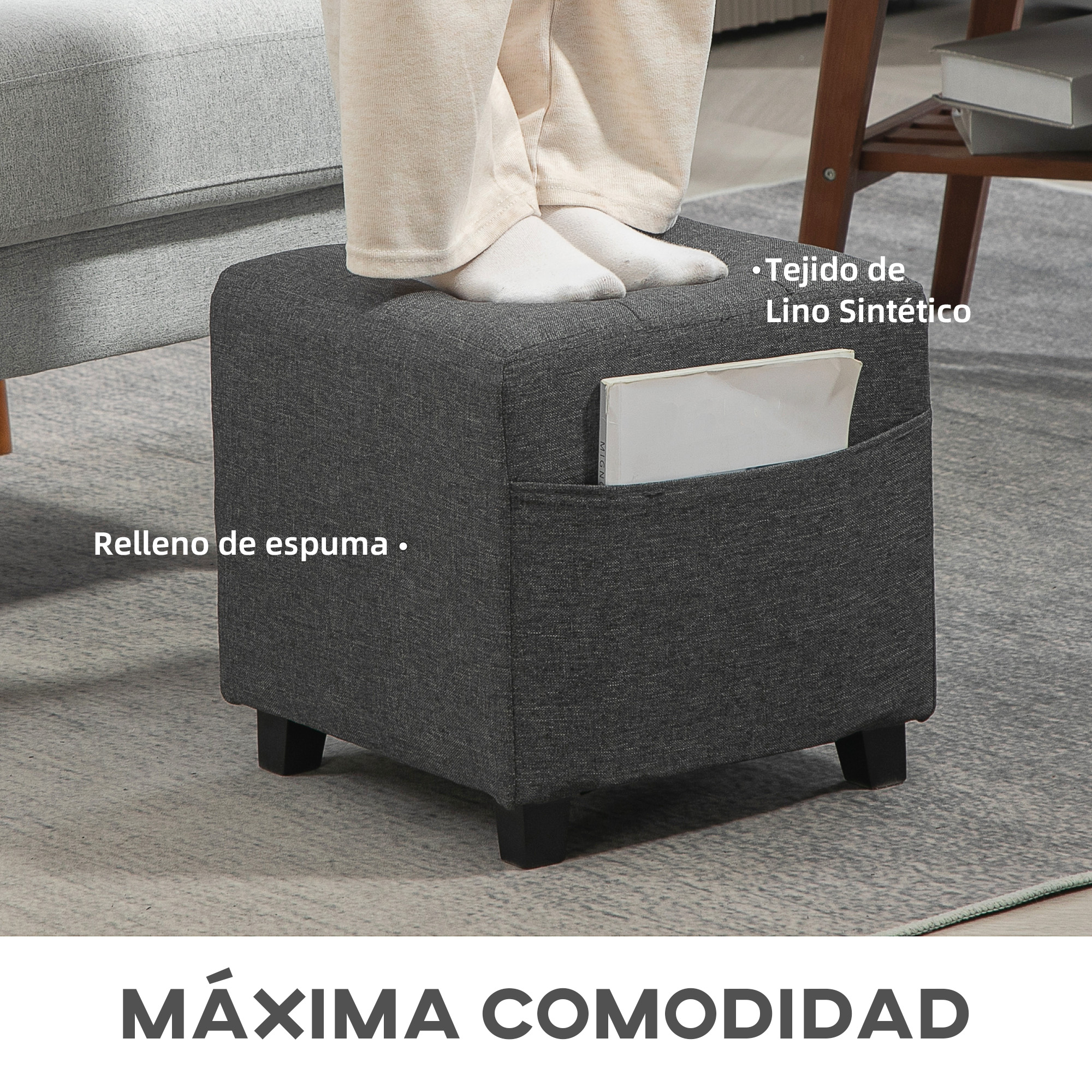 Un otomana gris oscuro con patas y un bolsillo lateral.