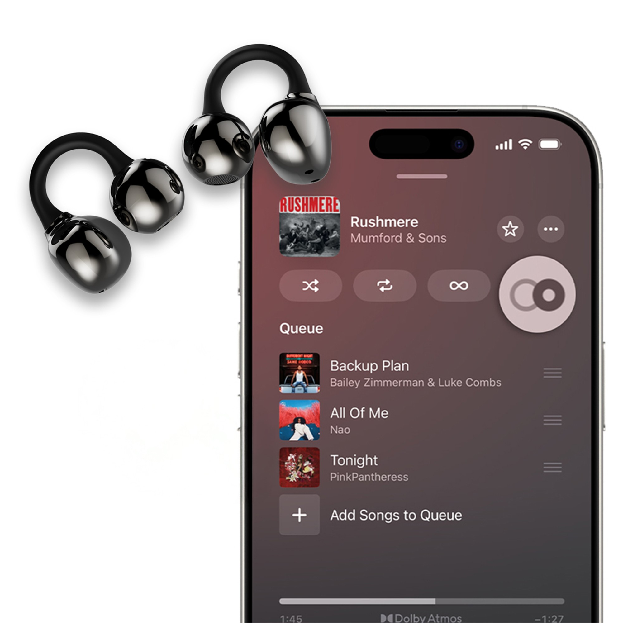 Parlak siyah kulaklıklar, müzik uygulaması gösteren bir akıllı telefonun yanında.