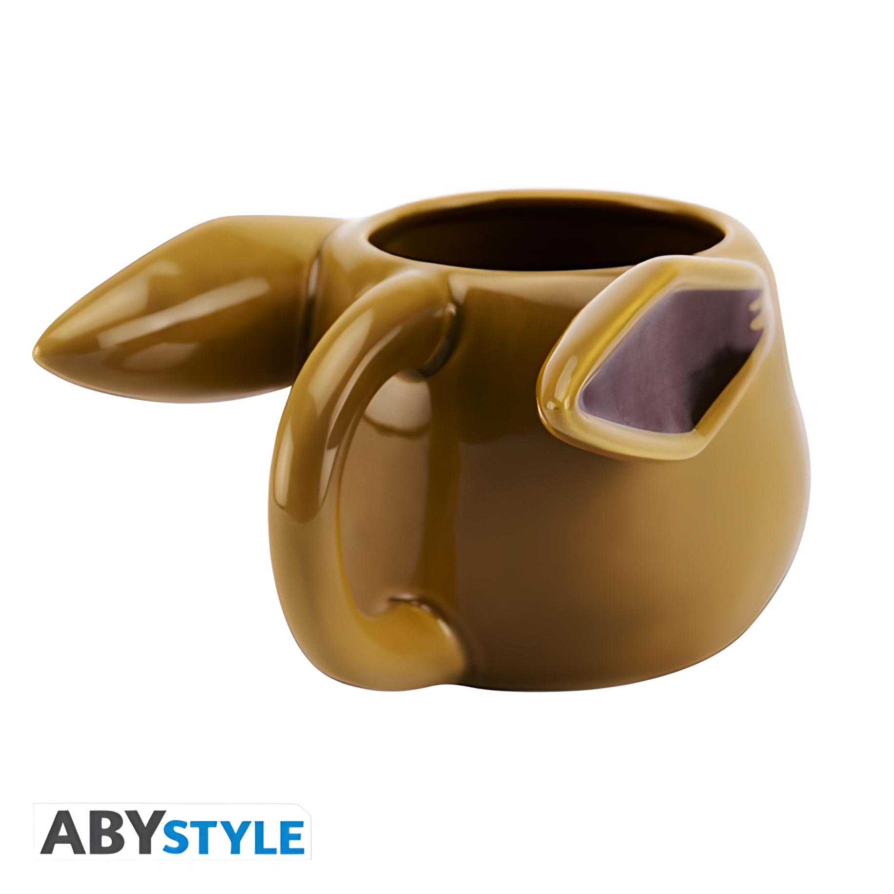 Eine braune, glänzende Tasse in Form eines Tieres mit spitzen Ohren und einem spitzen Schwanz.