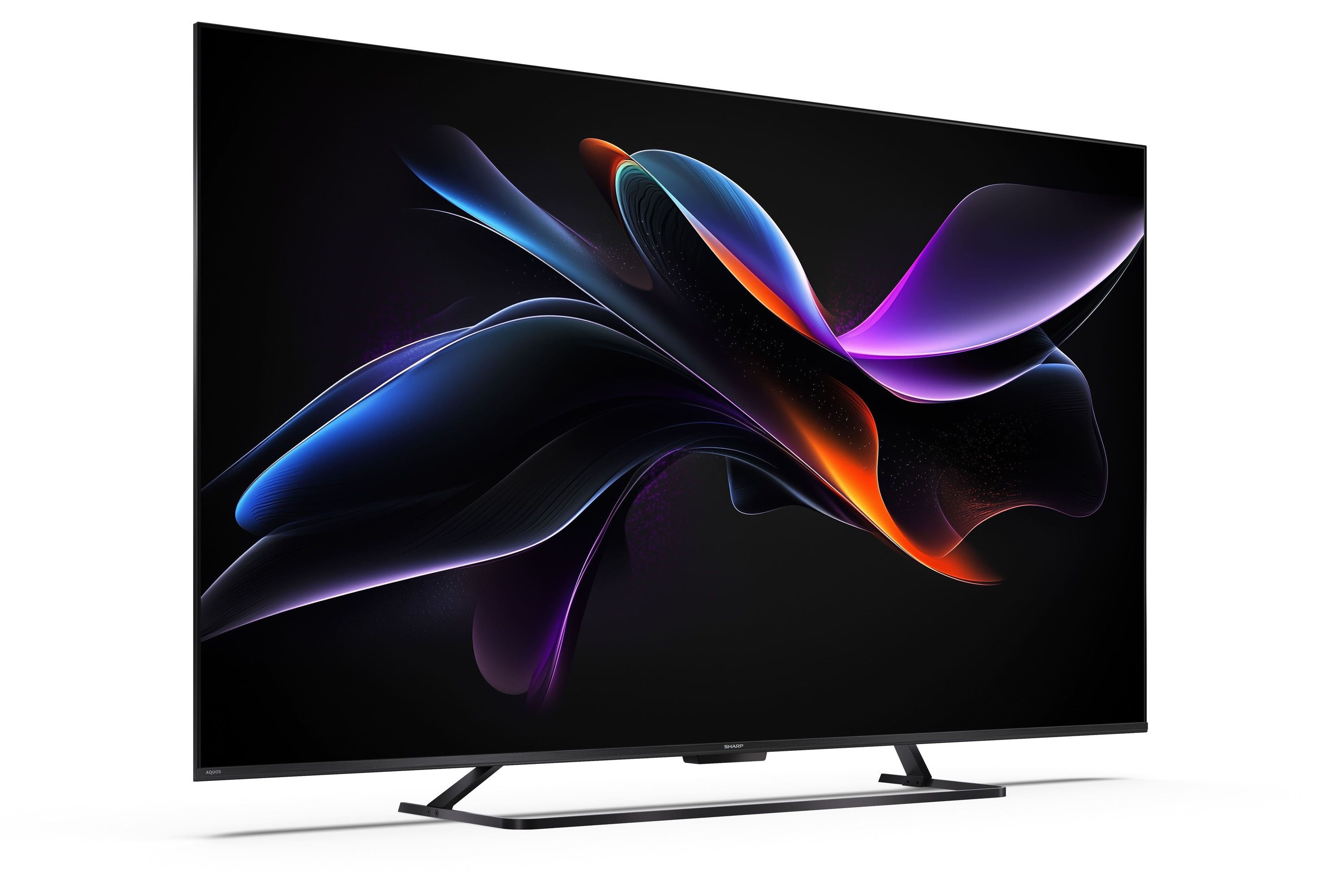 Un televisore moderno con uno screensaver astratto e colorato su sfondo nero.
