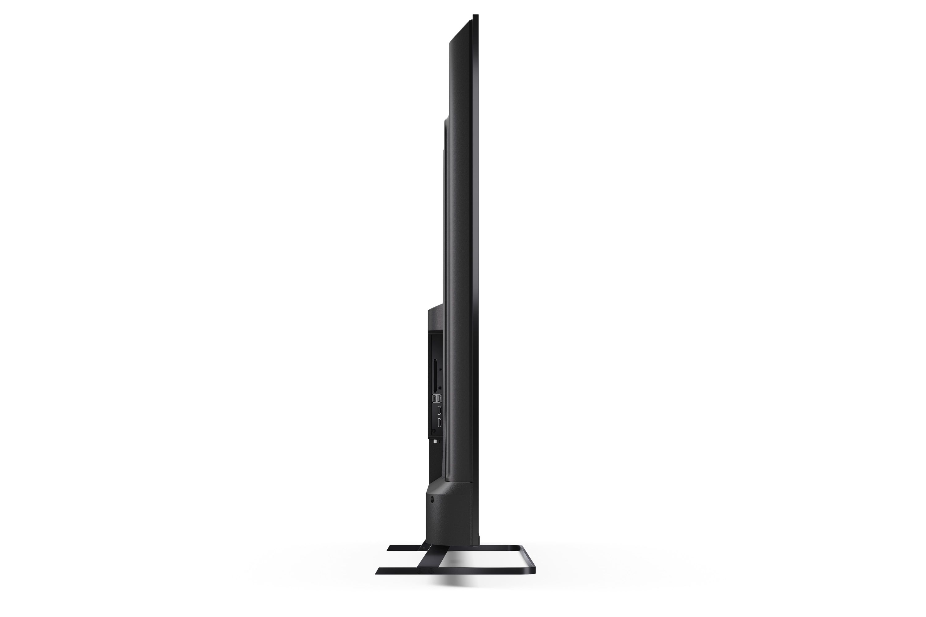 Vista laterale di un televisore nero con supporto e porte.