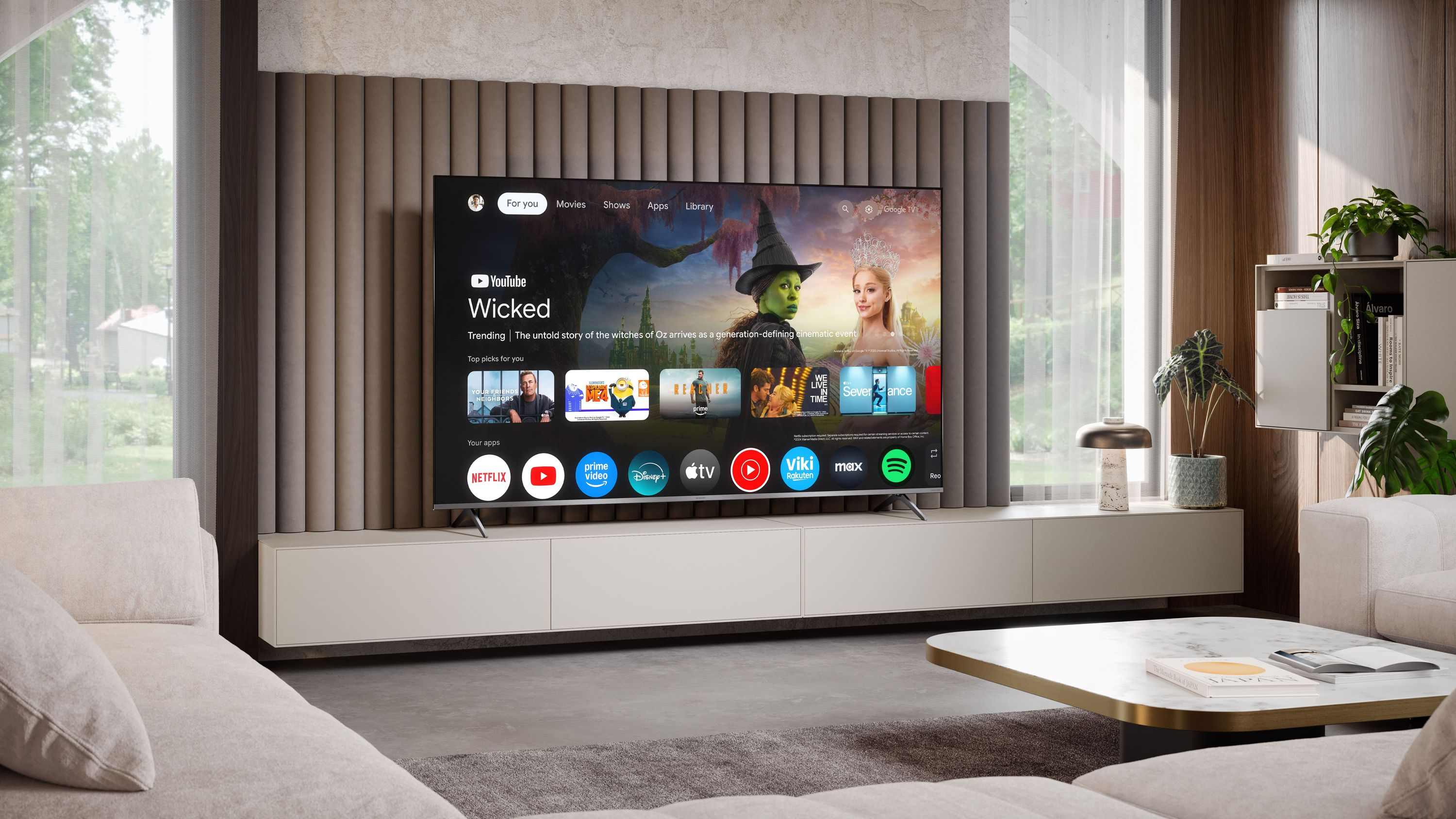 Un soggiorno moderno con un grande televisore che mostra un'interfaccia di app.
