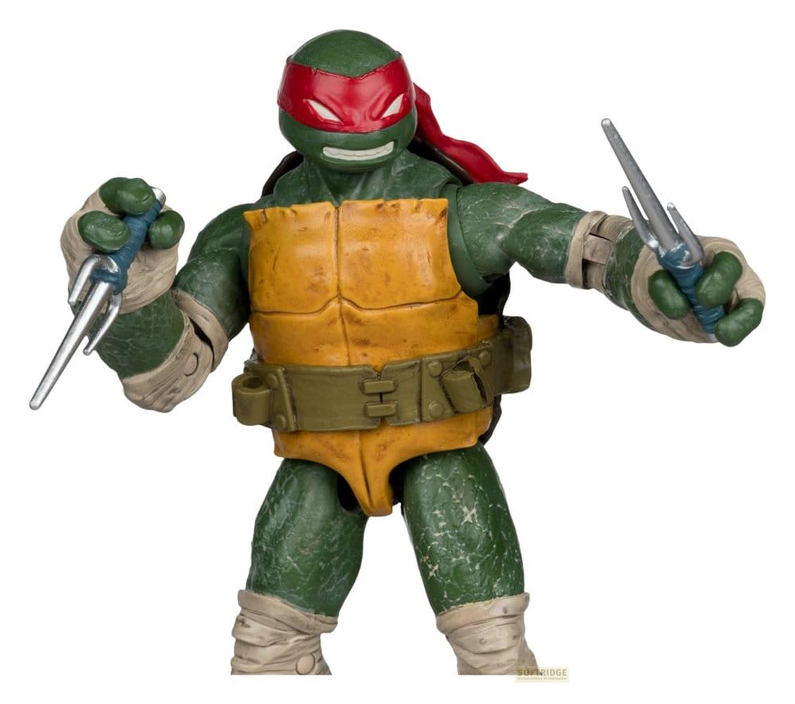 Action figure di Raphael, tartaruga verde con maschera rossa, che tiene due sai.