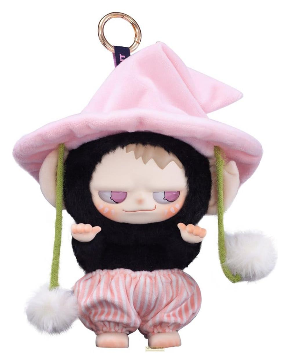 Eine Plüschfigur mit rosa Hut, schwarzem Fell und gestreifter Hose.