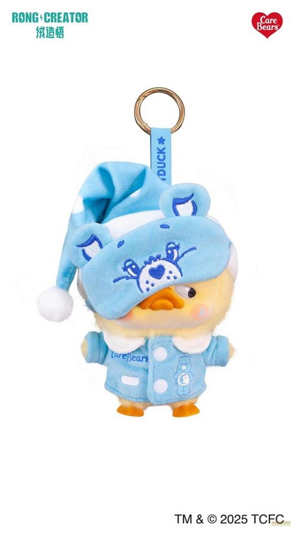 Eine blaue Entenfigur mit Schlafanzug und Schlafmaske, als Schlüsselanhänger.