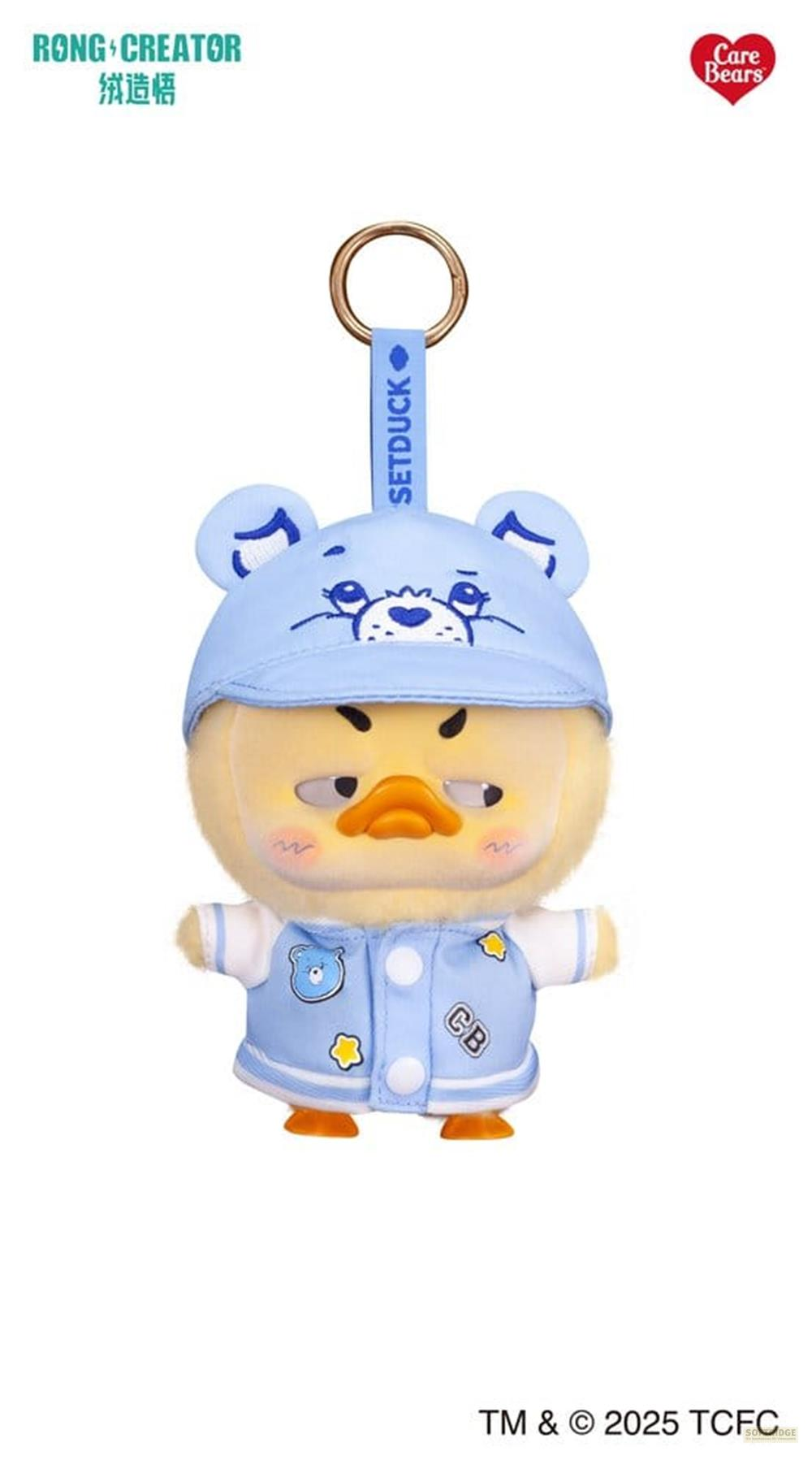 Eine blaue Entenfigur mit Hut und Jacke, die einen Schlüsselring trägt.