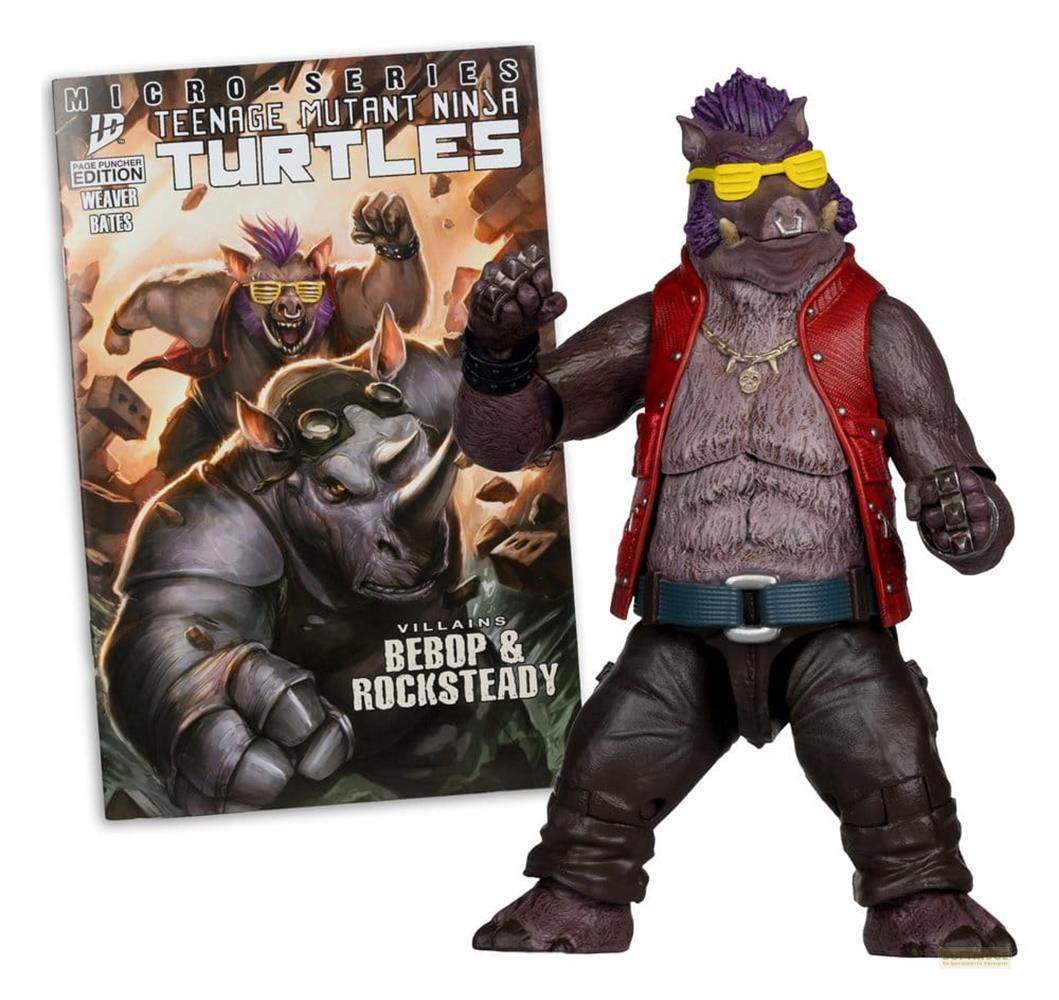 Action figure di Bebop accanto alla copertina del fumetto delle Tartarughe Ninja. Bebop indossa un gilet rosso.